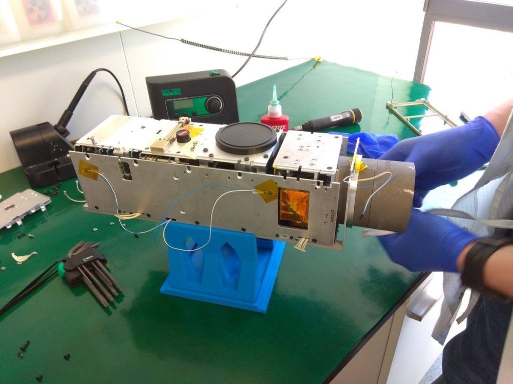 CubeSat propulsion solution for academic missions shown alongside spacecraft hardware during engineering integration and testing